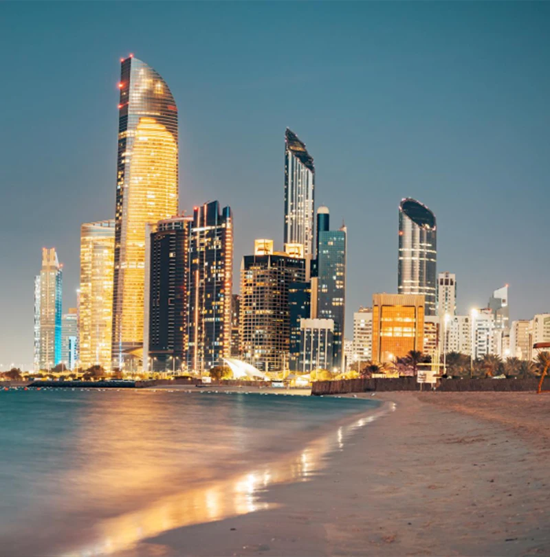 Stunning sandy beach near Corniche seaside with great night view of Abu Dhabi UAE